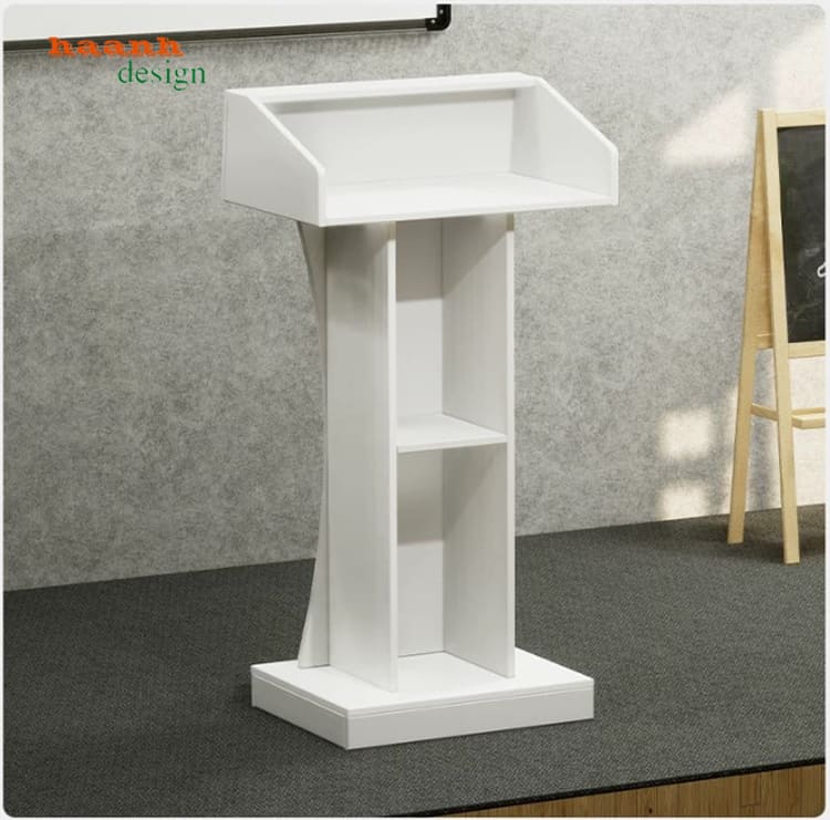Góc sau bục phát biểu trắng có hai ô kệ mở Góc sau bục phát biểu trắng có hai ô kệ mở