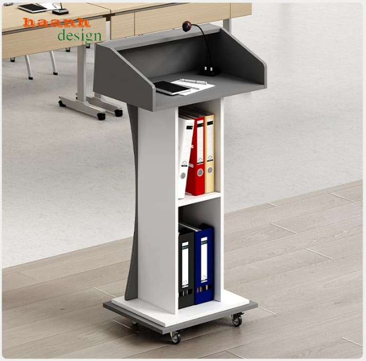 Bục phát biểu xám đậm mặt khay và các kệ phía sau Bục phát biểu xám đậm mặt khay và các kệ phía sau